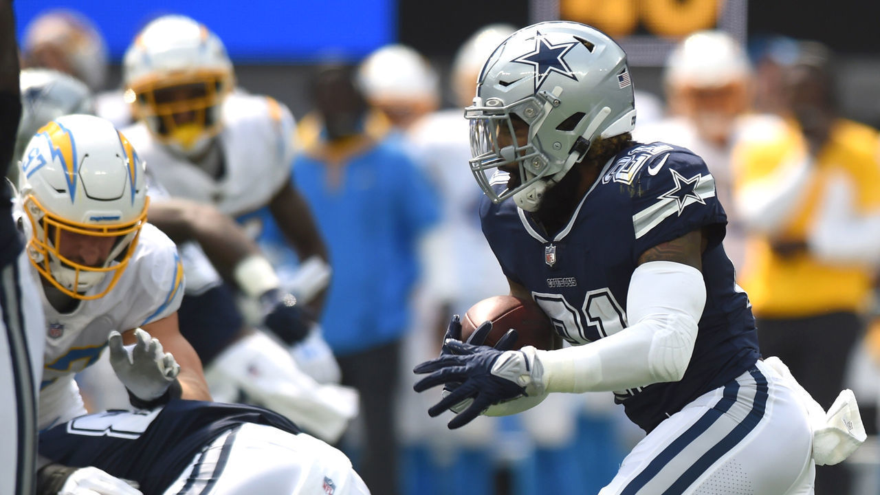 INGLEWOOD, CA - SEPTEMBER 19: Dallas Cowboys Running Back Ezekiel Elliott (21) runs the ball during an NFL game between the Dallas Cowboys and the Los Angeles Chargers on September 19, 2021, at SoFi Stadium in Inglewood, CA.