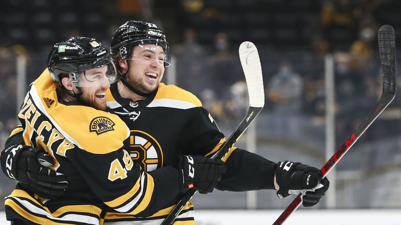 BOSTON, MA - MAY 21: Matt Grzelcyk #48 of the Boston Bruins reacts with Charlie McAvoy #73 after scoring in the third period in Game Four of the First Round of the 2021 Stanley Cup Playoffs against the Washington Capitals at TD Garden on May 21, 2021 in Boston, Massachusetts.