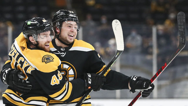 BOSTON, MA - MAY 21: Matt Grzelcyk #48 of the Boston Bruins reacts with Charlie McAvoy #73 after scoring in the third period in Game Four of the First Round of the 2021 Stanley Cup Playoffs against the Washington Capitals at TD Garden on May 21, 2021 in Boston, Massachusetts.