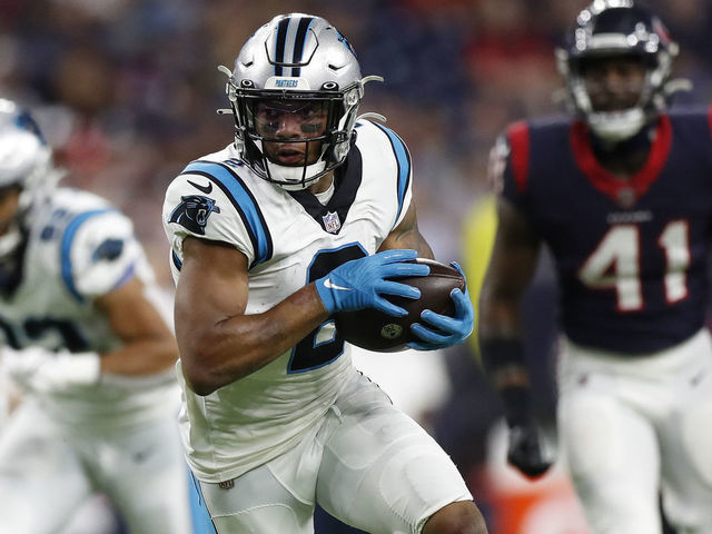 HOUSTON, TEXAS - SEPTEMBER 23: D.J. Moore #2 of the Carolina Panthers looks for yards after a first quarter catch while playing thge Houston Texans at NRG Stadium on September 23, 2021 in Houston, Texas.