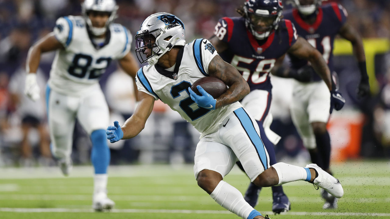 HOUSTON, TEXAS - SEPTEMBER 23: D.J. Moore #2 of the Carolina Panthers looks for yards after a first quarter catch while playing thge Houston Texans at NRG Stadium on September 23, 2021 in Houston, Texas.