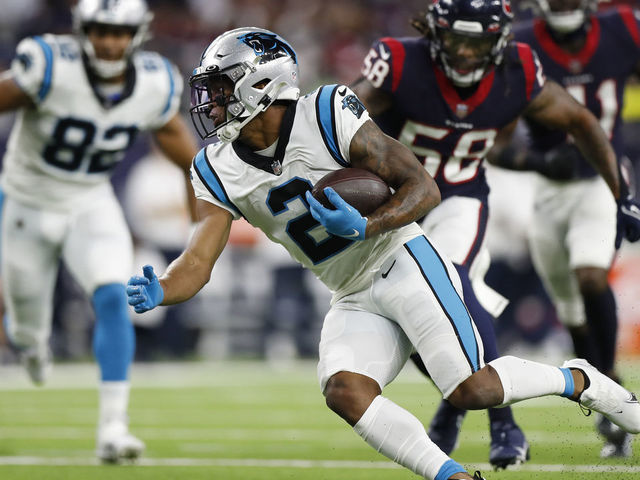 HOUSTON, TEXAS - SEPTEMBER 23: D.J. Moore #2 of the Carolina Panthers looks for yards after a first quarter catch while playing thge Houston Texans at NRG Stadium on September 23, 2021 in Houston, Texas.