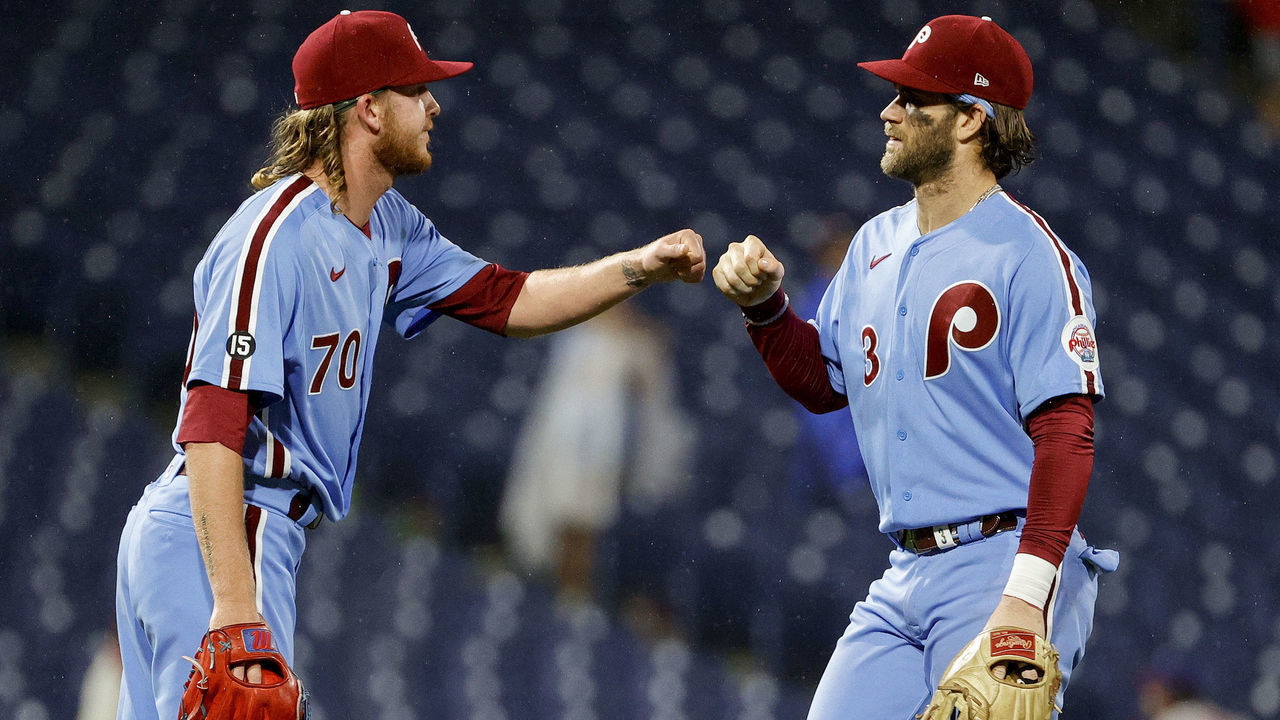 PHILADELPHIA, PENNSYLVANIA - SEPTEMBER 23: Bailey Falter #70 and Bryce Harper #3 of the Philadelphia Phillies celebrate afte defeating the Pittsburgh Pirates at Citizens Bank Park on September 23, 2021 in Philadelphia, Pennsylvania.