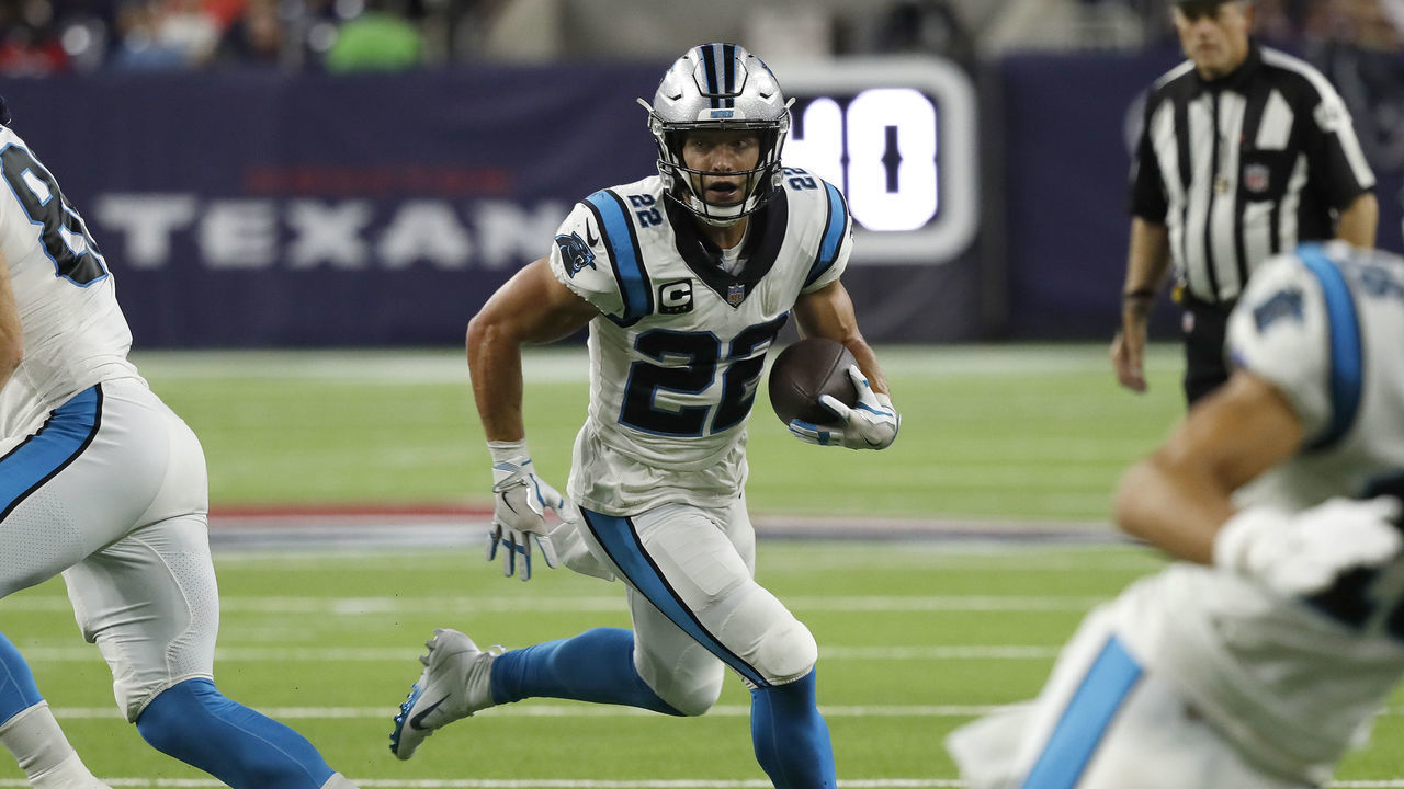 HOUSTON, TEXAS - SEPTEMBER 23: Christian McCaffrey #22 of the Carolina Panthers looks for yards agains the Houston Texans during a first half run at NRG Stadium on September 23, 2021 in Houston, Texas.