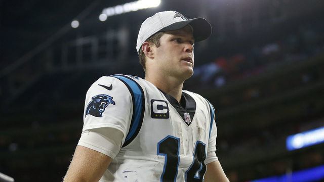 HOUSTON, TEXAS - SEPTEMBER 23: Sam Darnold #14 of the Carolina Panthers leaves the field after a 24-9 win over the Houston Texans at NRG Stadium on September 23, 2021 in Houston, Texas.