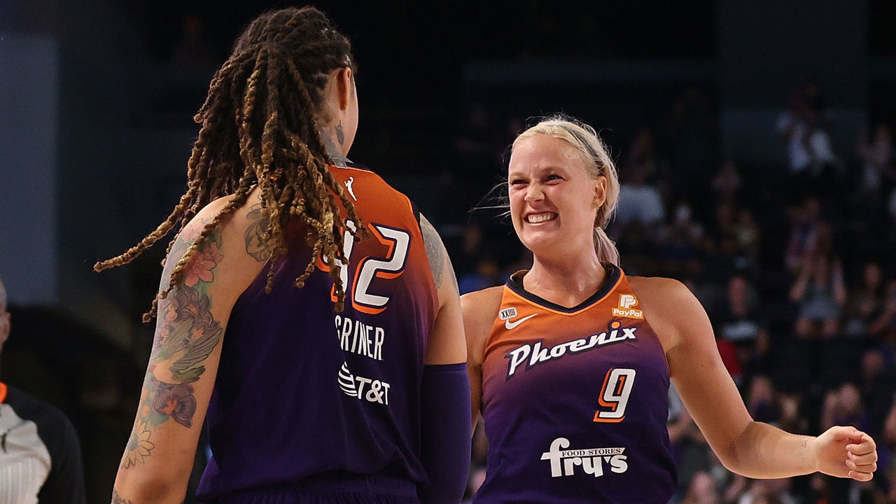 PHOENIX, ARIZONA - SEPTEMBER 23: Sophie Cunningham #9 of the Phoenix Mercury celebrates with Brittney Griner #42 during the final moments of the first round WNBA playoffs against the New York Liberty at Grand Canyon University Arena on September 23, 2021 in Phoenix, Arizona. The Mercury defeated the Liberty 83-82. ˆ