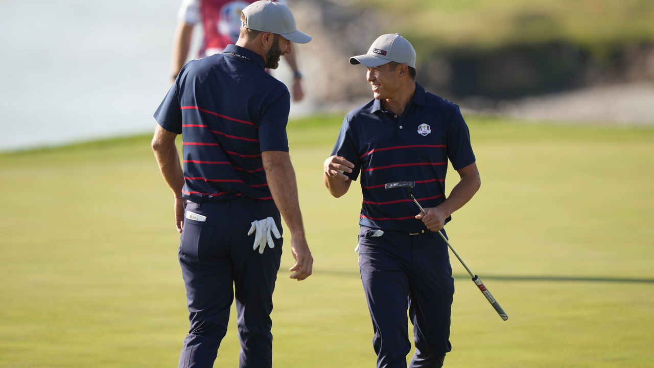KOHLER, WI - SEPTEMBER 24: Dustin Johnson, L, and Collin Morikawa of Team United States celebrate Morikawas hole winning putt on the eighth during the 2020 Ryder Cup at Whistling Straits on September 24, 2021 in Kohler, Wisconsin.