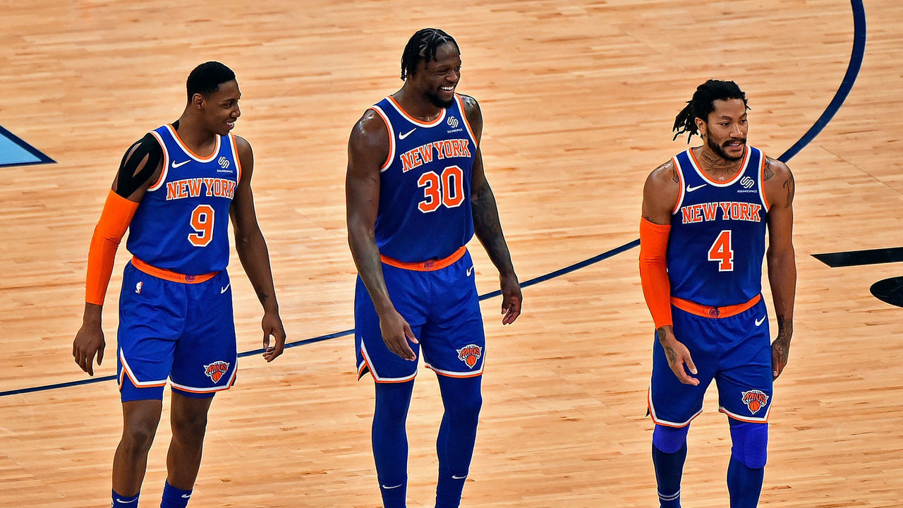 MEMPHIS, TENNESSEE - MAY 03: RJ Barrett #9, Julius Randle #30 and Derrick Rose #4 of the New York Knicks walk on the court during the second half against the Memphis Grizzlies at FedExForum on May 03, 2021 in Memphis, Tennessee.