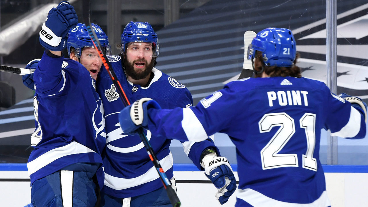 EDMONTON, ALBERTA - SEPTEMBER 26: Ondrej Palat #18 of the Tampa Bay Lightning celebrates with Nikita Kucherov #86 and Brayden Point #21 after Palat scored in the second period of Game Five of the 2020 NHL Stanley Cup Final between the Dallas Stars and the Tampa Bay Lightning at Rogers Place on September 26, 2020 in Edmonton, Alberta, Canada.