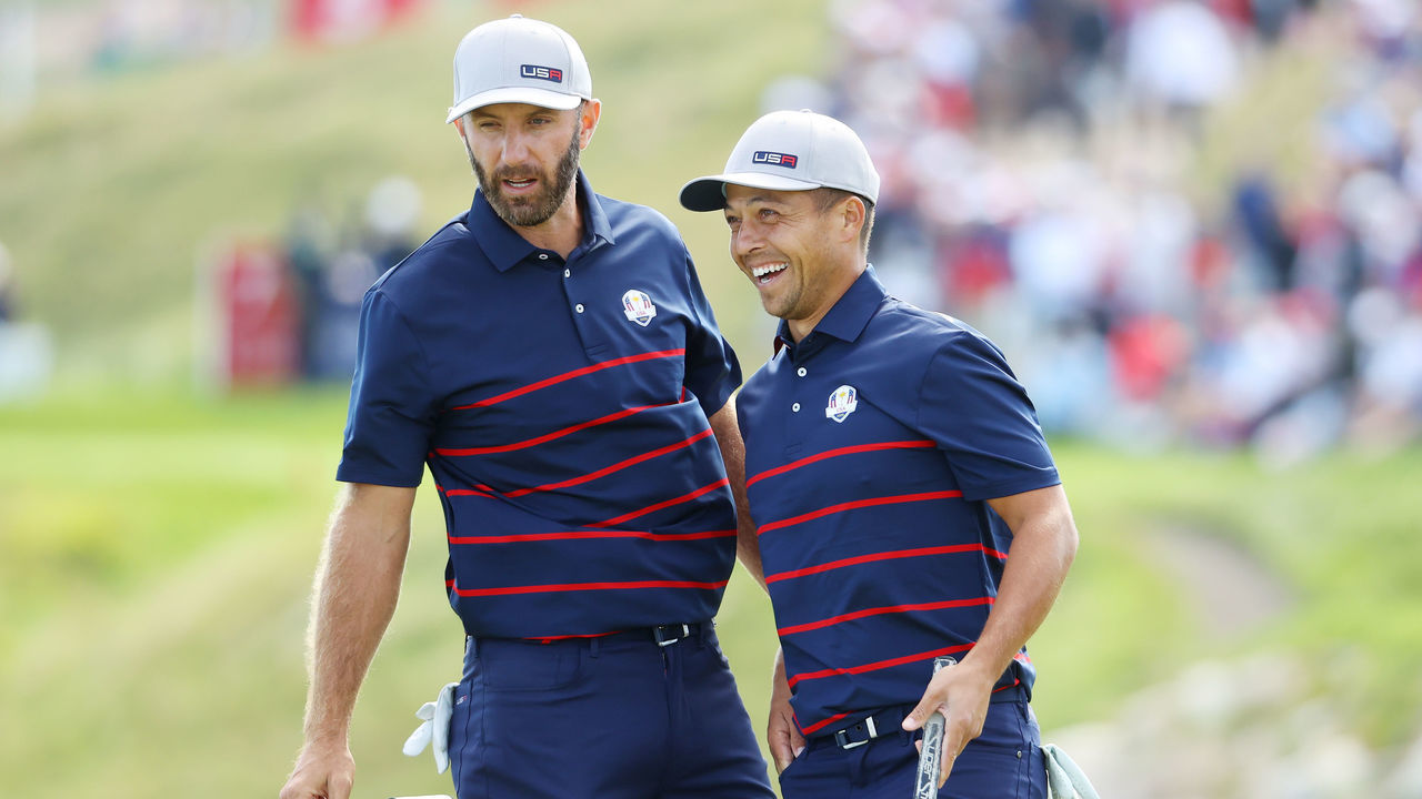 KOHLER, WISCONSIN - SEPTEMBER 24: Dustin Johnson of team United States (L) and Xander Schauffele of team United States react on the seventh green during Friday Afternoon Fourball Matches of the 43rd Ryder Cup at Whistling Straits on September 24, 2021 in Kohler, Wisconsin.