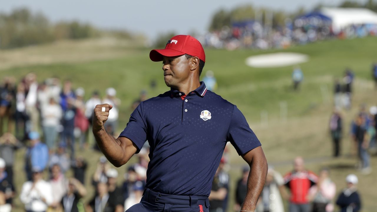 US golfer Tiger Woods reacts on the third day of the 42nd Ryder Cup at Le Golf National Course at Saint-Quentin-en-Yvelines, south-west of Paris, on September 30, 2018.
