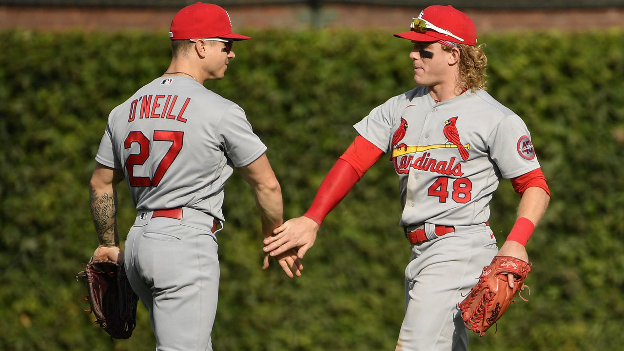 CHICAGO, ILLINOIS - SEPTEMBER 24: Tyler O'Neill #27 and Harrison Bader #48 of the St. Louis Cardinals celebrate after the win in game one of a doubleheader against the Chicago Cubs at Wrigley Field on September 24, 2021 in Chicago, Illinois.