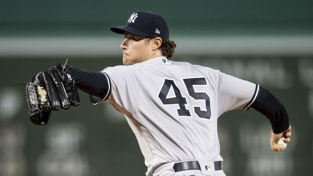 BOSTON, MA - SEPTEMBER 24: Gerrit Cole #45 of the New York Yankees delivers during the first inning of a game against the Boston Red Sox on September 24, 2021 at Fenway Park in Boston, Massachusetts.