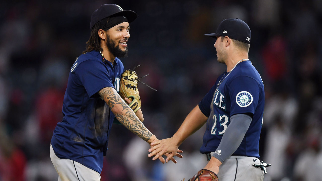 ANAHEIM, CA - SEPTEMBER 24: Seattle Mariners shortstop J.P. Crawford (3) and first baseman Ty France (23) on the field after the Mariners defeated the Los Angeles Angels 6 to 5 in a game played on September 24, 2021 at Angel Stadium in Anaheim, CA.