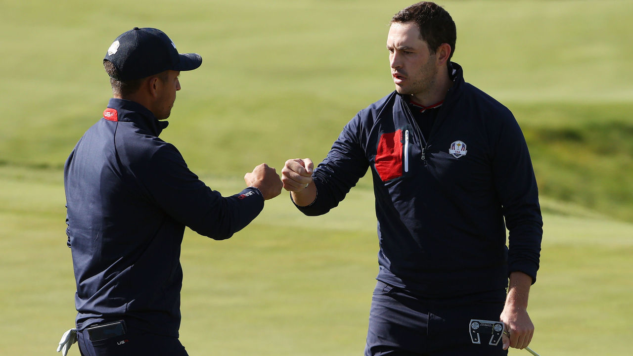 KOHLER, WISCONSIN - SEPTEMBER 25: Xander Schauffele of team United States (L) and Patrick Cantlay of team United States celebrate on the 10th green during Saturday Morning Foursome Matches of the 43rd Ryder Cup at Whistling Straits on September 25, 2021 in Kohler, Wisconsin.
