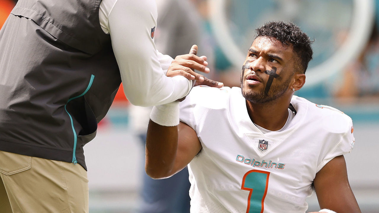 MIAMI GARDENS, FLORIDA - SEPTEMBER 19: Head coach Brian Flores of the Miami Dolphins greets Tua Tagovailoa #1 prior to the game against the Buffalo Bills at Hard Rock Stadium on September 19, 2021 in Miami Gardens, Florida.