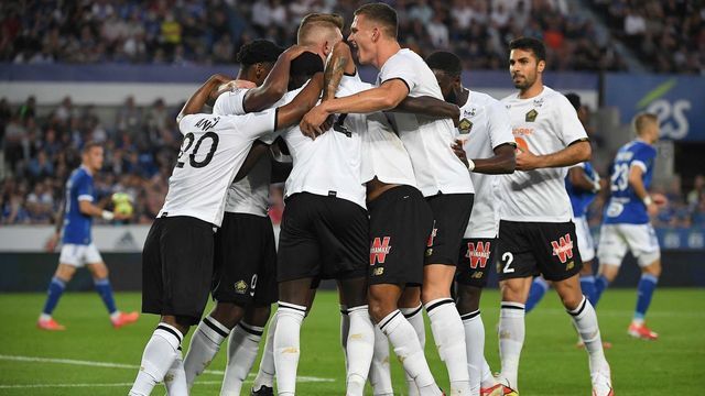 Lille's players celebrate after scoring a goal during the French L1 football match between Strasbourg (RCSA) and Lille (LOSC) at The Meinau Stadium in Strasbourg, eastern France, on September 25, 2021.