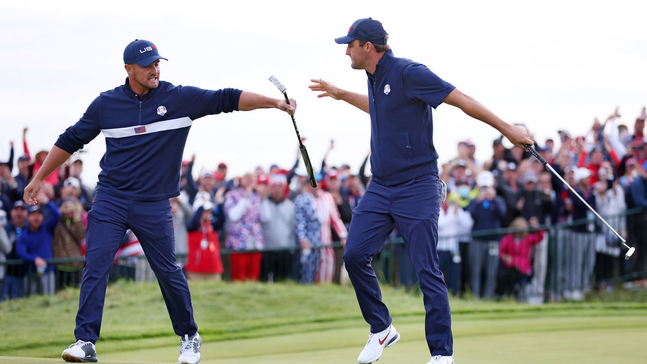 KOHLER, WISCONSIN - SEPTEMBER 25: Bryson DeChambeau of team United States (L) and Scottie Scheffler of team United States celebrate on the 15th green during Saturday Afternoon Fourball Matches of the 43rd Ryder Cup at Whistling Straits on September 25, 2021 in Kohler, Wisconsin.