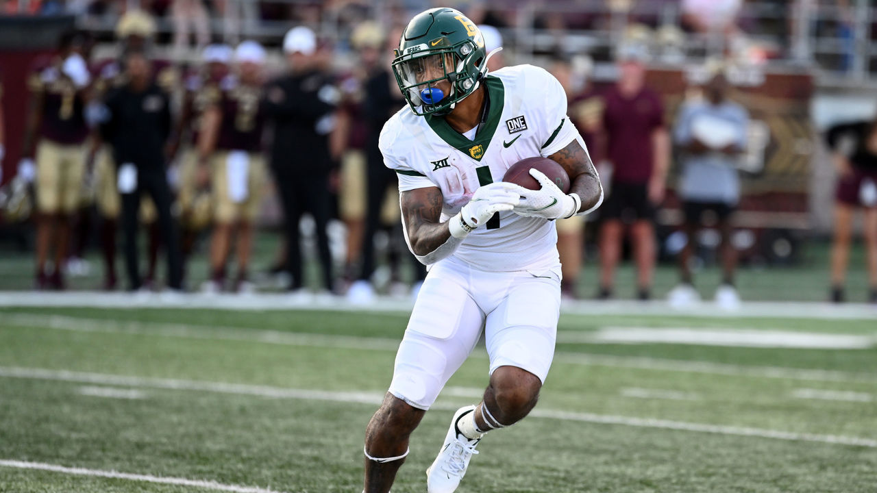 SAN MARCOS, TX - SEPTEMBER 04: Baylor Bears RB Trestan Ebner runs for yardage during game between the Baylor Bears and the Texas State Bobcats at Bobcat Stadium in San Marcos, TX.