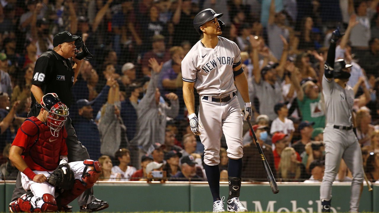 BOSTON, MA - SEPTEMBER 25: Giancarlo Stanton #27 of the New York Yankees connects for a grand slam home run against the Boston Red Sox in the eighth inning at Fenway Park on September 25, 2021 in Boston, Massachusetts.