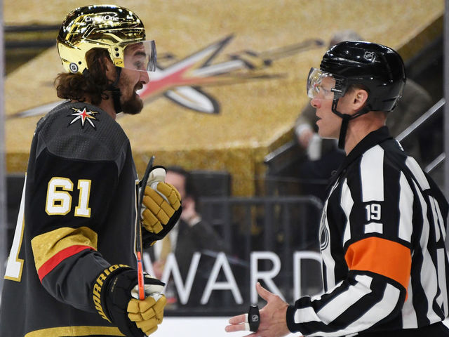 LAS VEGAS, NEVADA - MARCH 29: Mark Stone #61 of the Vegas Golden Knights talks to referee Gord Dwyer in the second period of the Golden Knights' game against the Los Angeles Kings at T-Mobile Arena on March 29, 2021 in Las Vegas, Nevada. The Golden Knights defeated the Kings 4-1.