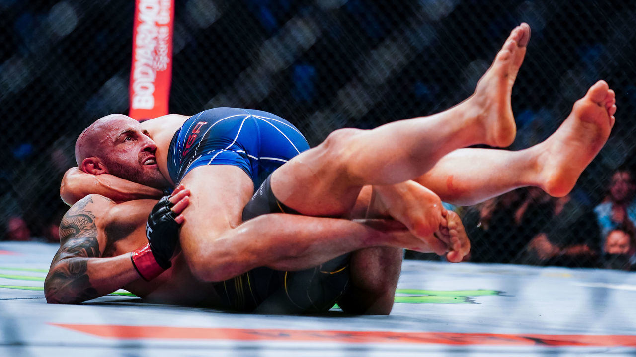 LAS VEGAS, NV - SEPTEMBER 25: Alexander Volkanovski of Australia and Brian Ortega grapple on the ground during their Featherweight title fight during UFC 266 at T-Mobile Arena on September 25, 2021 in Las Vegas, Nevada.