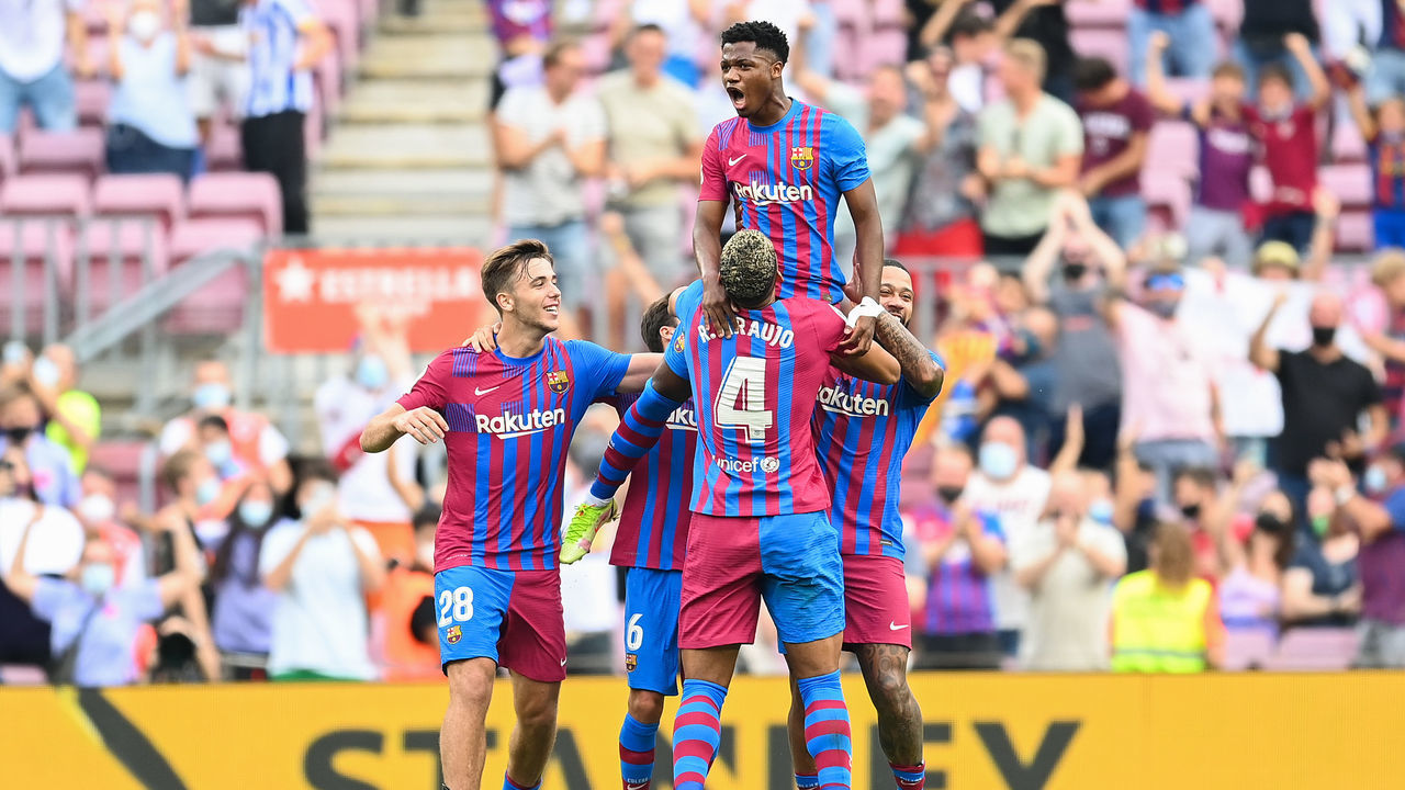 BARCELONA, SPAIN - SEPTEMBER 26: Ansu Fati of FC Barcelona celebrates with his team mates after scoring his team's third goal during the LaLiga Santander match between FC Barcelona and Levante UD at Camp Nou on September 26, 2021 in Barcelona, Spain.