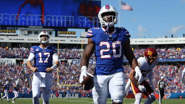 ORCHARD PARK, NEW YORK - SEPTEMBER 26: Quarterback Josh Allen #17 and Zack Moss #20 of the Buffalo Bills react after Moss scored a touchdown against the Washington Football Team in the second quarter of the game at Highmark Stadium on September 26, 2021 in Orchard Park, New York.