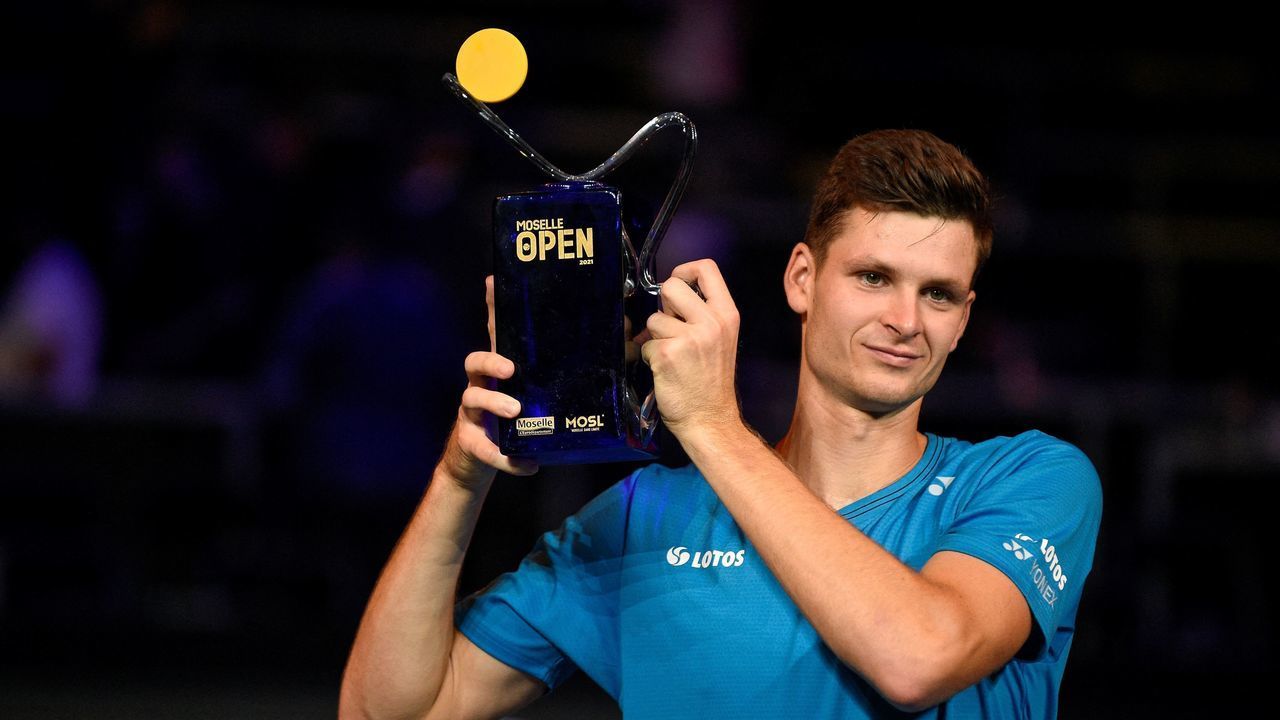 Poland's Hubert Hurkacz celebrates his victory over Spain's Pablo Carreno Busta, posing with the trophy after winning the ATP Moselle Open final tennis match in Metz, northeastern France on September 26, 2021.
