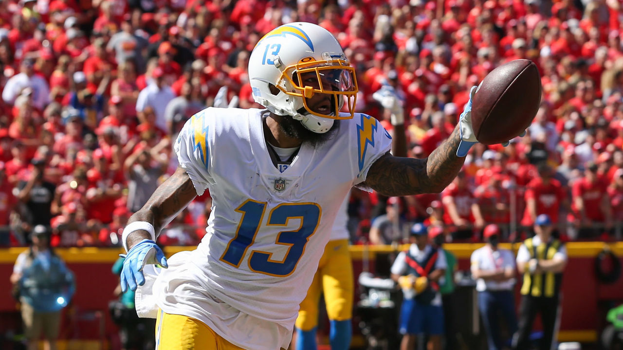 KANSAS CITY, MO - SEPTEMBER 26: Los Angeles Chargers wide receiver Keenan Allen (13) holds the ball up after a 4-yard touchdown reception in the first quarter of an AFC West matchup between the Los Angeles Chargers and Kansas City Chiefs on Sep 26, 2021 at GEHA Filed at Arrowhead Stadium in Kansas City, MO.