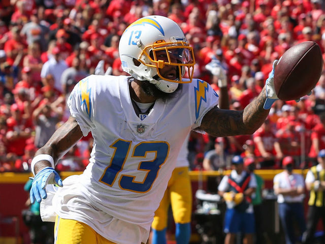 KANSAS CITY, MO - SEPTEMBER 26: Los Angeles Chargers wide receiver Keenan Allen (13) holds the ball up after a 4-yard touchdown reception in the first quarter of an AFC West matchup between the Los Angeles Chargers and Kansas City Chiefs on Sep 26, 2021 at GEHA Filed at Arrowhead Stadium in Kansas City, MO.