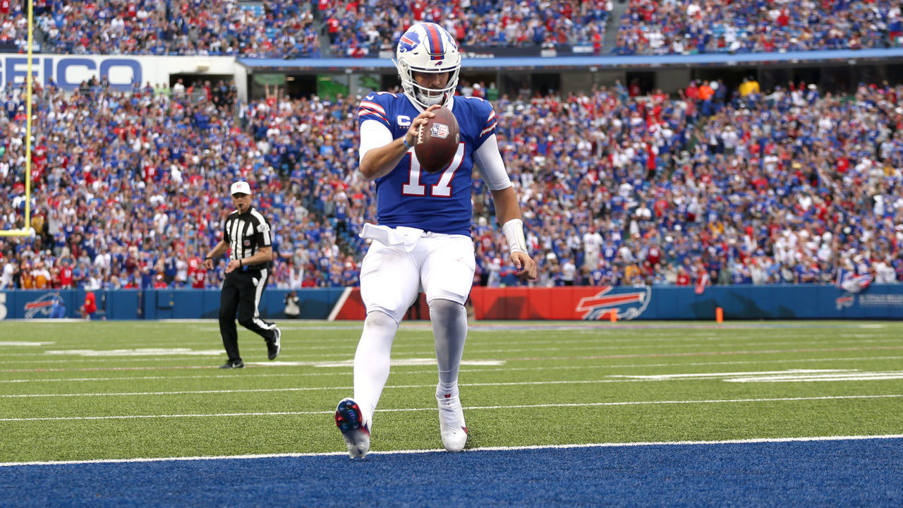 ORCHARD PARK, NEW YORK - SEPTEMBER 26: Quarterback Josh Allen #17 of the Buffalo Bills rushes for a touchdown during the fourth quarter of the game against the Washington Football Team at Highmark Stadium on September 26, 2021 in Orchard Park, New York.