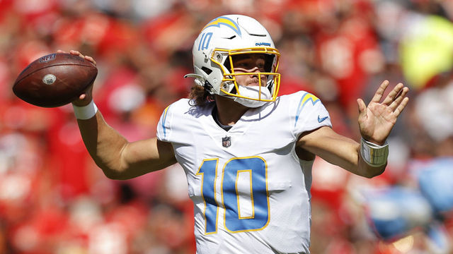 KANSAS CITY, MISSOURI - SEPTEMBER 26: Justin Herbert #10 of the Los Angeles Chargers throws the ball during the first quarter in the game against Kansas City Chiefs at Arrowhead Stadium on September 26, 2021 in Kansas City, Missouri.