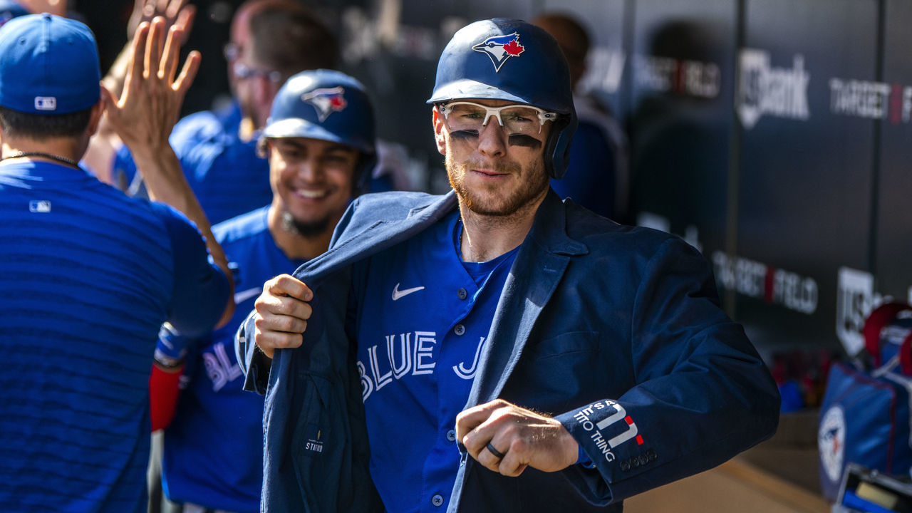 MINNEAPOLIS, MN - SEPTEMBER 26: Danny Jansen #9 of the Toronto Blue Jays celebrates with teammates while wearing the blue Home Run Jacket after hitting a three run home run in the second inning of the game against the Minnesota Twins at Target Field on September 26, 2021 in Minneapolis, Minnesota.