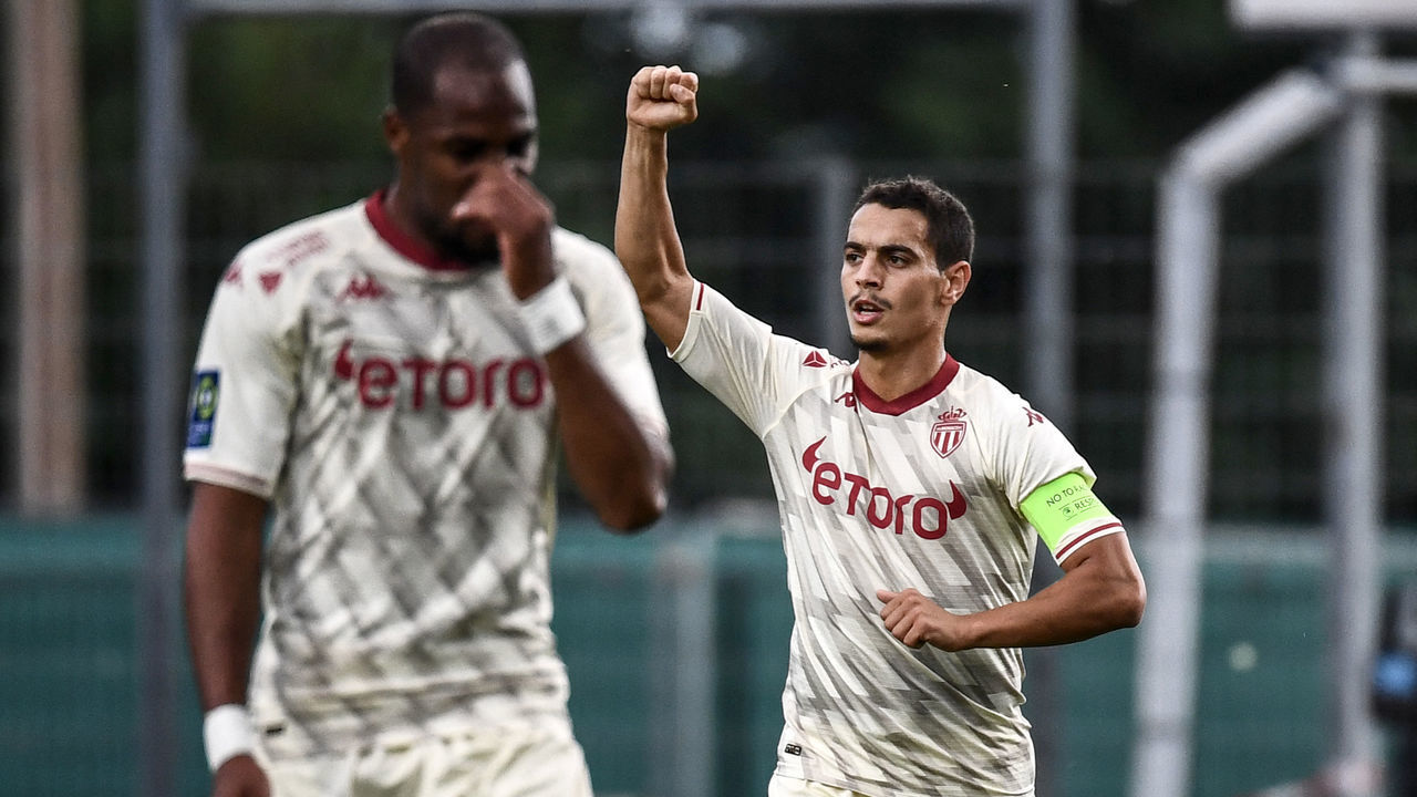 Monaco's French forward Wissam Ben Yedder (R) celebrates after scoring a goal during the French L1 football match between Clermont Foot 63 and AS Monaco at Stade Gabriel Montpied in Clermont-Ferrand, central France on September 26, 2021.
