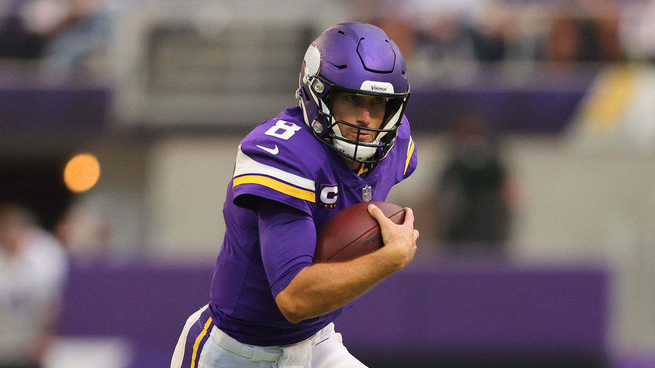 MINNEAPOLIS, MINNESOTA - SEPTEMBER 26: Kirk Cousins #8 of the Minnesota Vikings is chased out of pocket during the second quarter in the game against the Seattle Seahawks at U.S. Bank Stadium on September 26, 2021 in Minneapolis, Minnesota.