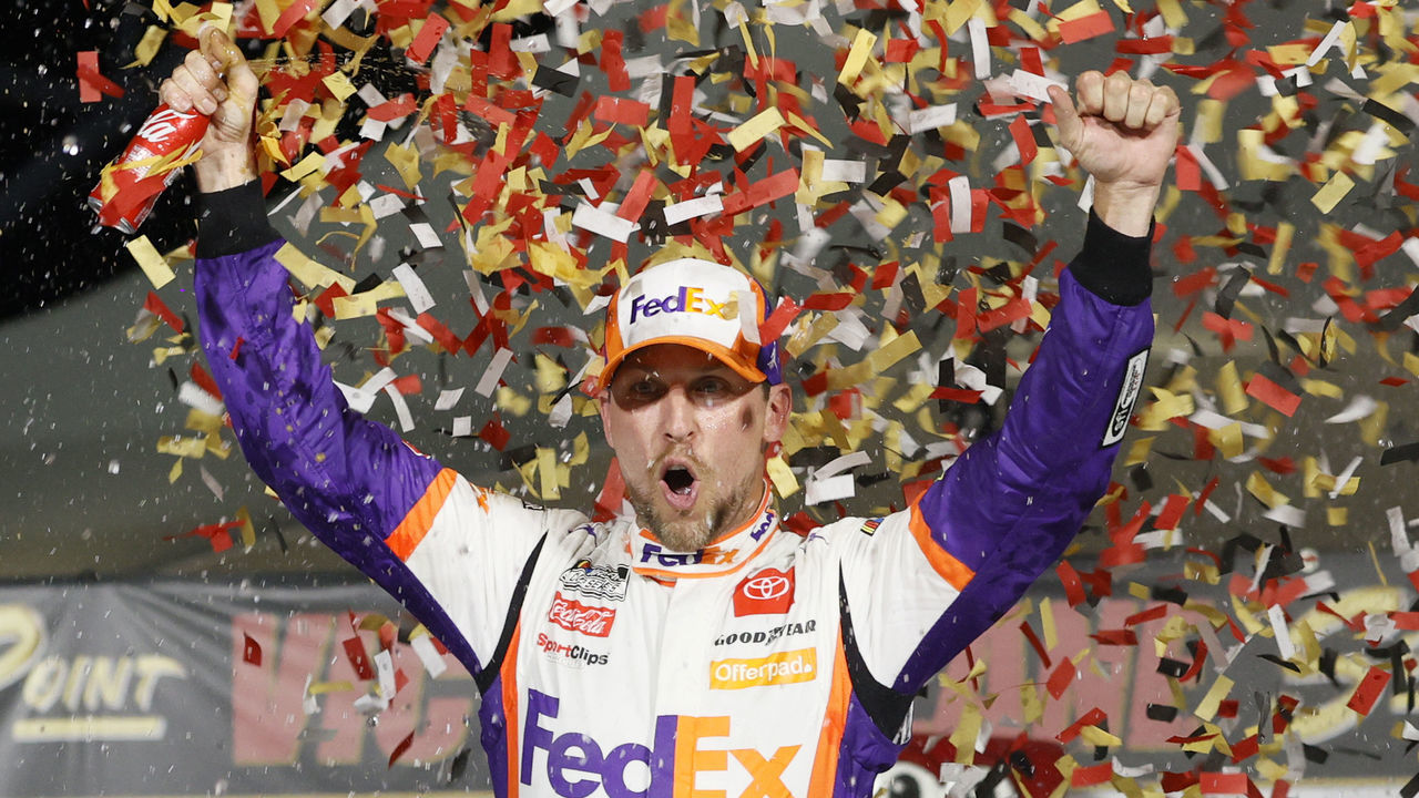 LAS VEGAS, NEVADA - SEPTEMBER 26: Denny Hamlin, driver of the #11 FedEx Office Toyota, celebrates in victory lane after winning the NASCAR Cup Series South Point 400 at Las Vegas Motor Speedway on September 26, 2021 in Las Vegas, Nevada.