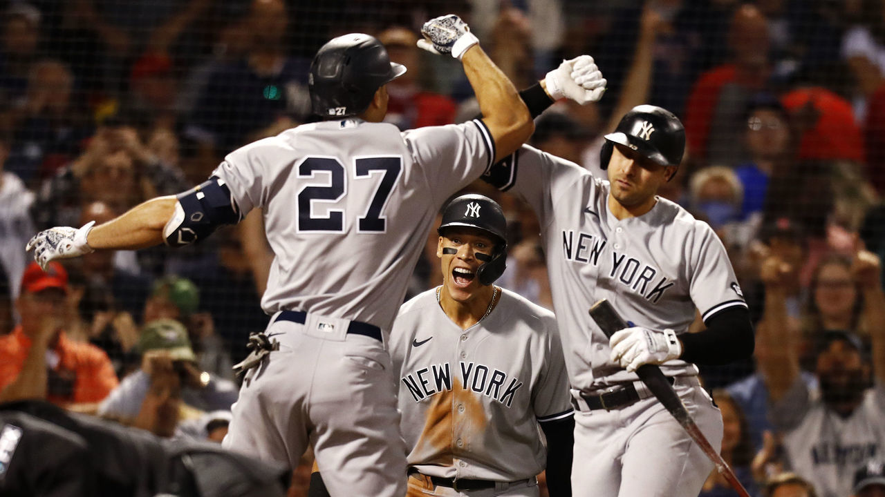 BOSTON, MASSACHUSETTS - SEPTEMBER 26: Aaron Judge #99 of the New York Yankees react as Giancarlo Stanton #27 and Joey Gallo #13 celebrate in the top of the eighth inning against the Boston Red Sox at Fenway Park on September 26, 2021 in Boston, Massachusetts.