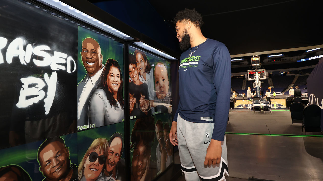 MINNEAPOLIS, MN - MAY 13: Karl-Anthony Towns #32 of the Minnesota Timberwolves walks through the Raised by Wolves Campaign created by Reggie LeFlore of people who have raised or inspired the players on May 13, 2021 at Target Center in Minneapolis, Minnesota. Mandatory Copyright Notice: Copyright 2021 NBAE