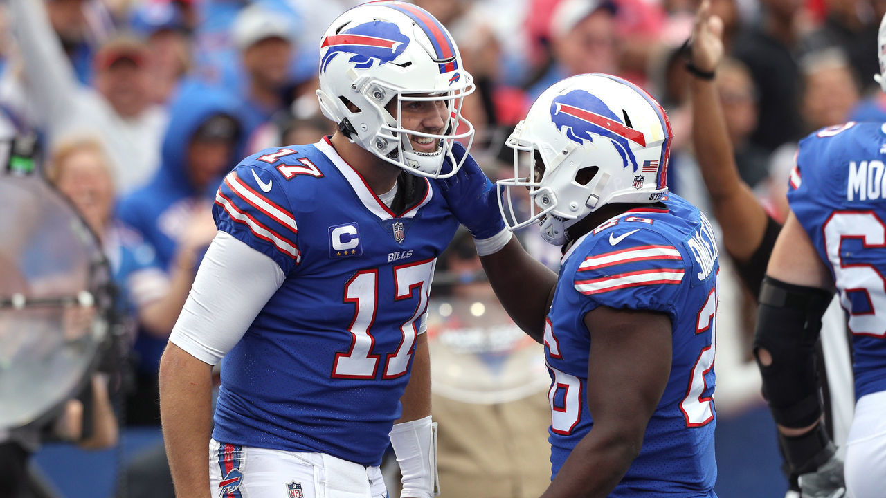ORCHARD PARK, NEW YORK - SEPTEMBER 26: Josh Allen #17 of the Buffalo Bills celebrates a touchdown with Devin Singletary #26 of the Buffalo Bills in the game against the Washington Football Team at Highmark Stadium on September 26, 2021 in Orchard Park, New York.