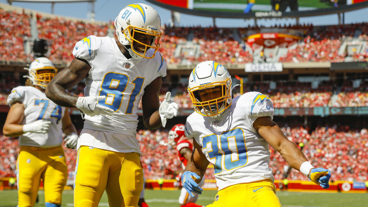 KANSAS CITY, MO - SEPTEMBER 26: Austin Ekeler #30 of the Los Angeles Chargers celebrates his second quarter touchdown with Mike Williams #81 of the Los Angeles Chargers against the Kansas City Chiefs at Arrowhead Stadium on September 26, 2021 in Kansas City, Missouri.