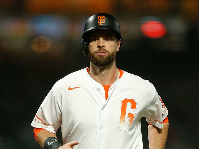 SAN FRANCISCO, CALIFORNIA - SEPTEMBER 14: Brandon Belt #9 of the San Francisco Giants runs to home plate to score against the San Diego Padres at Oracle Park on September 14, 2021 in San Francisco, California.
