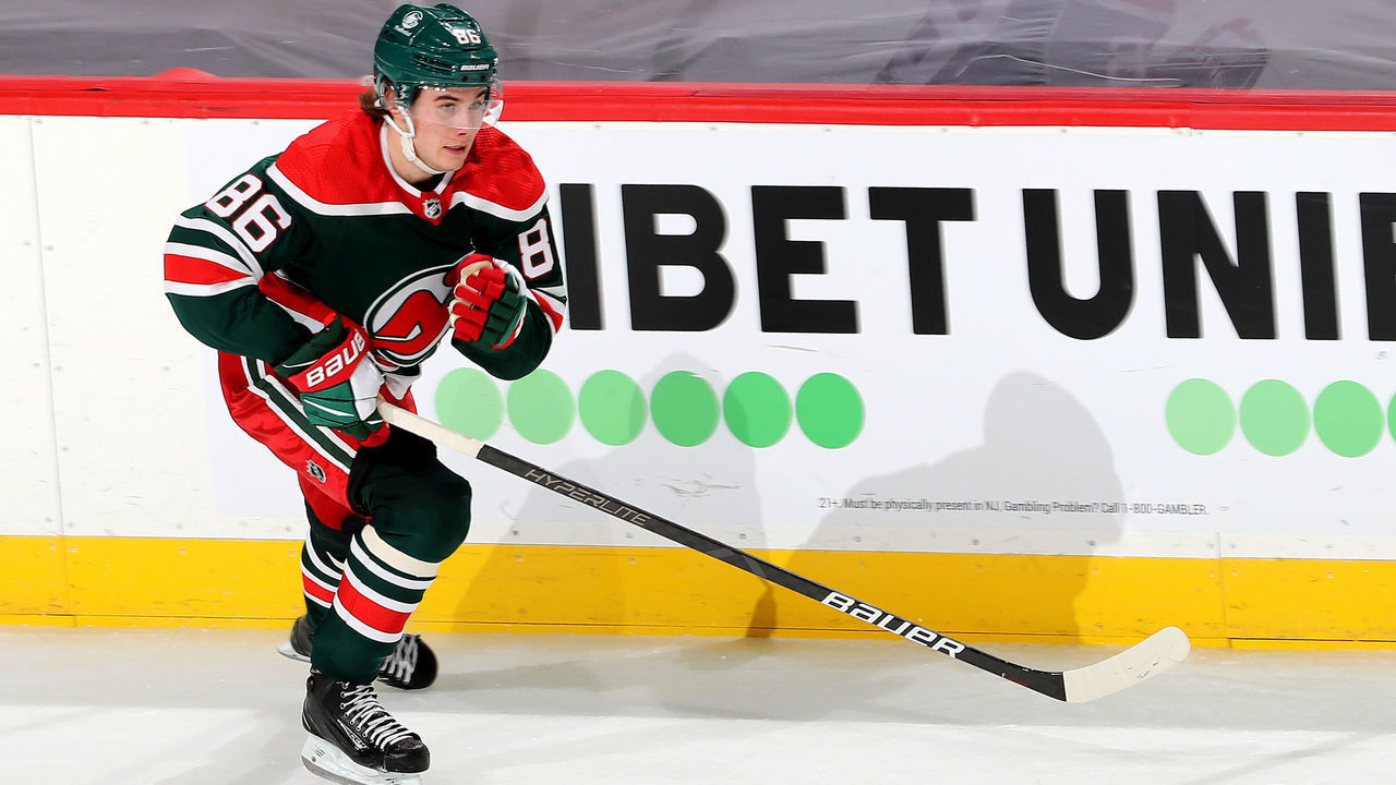 NEWARK, NEW JERSEY - APRIL 27: Jack Hughes #86 of the New Jersey Devils takes the puck in the second period against the Philadelphia Flyers at Prudential Center on April 27, 2021 in Newark, New Jersey.