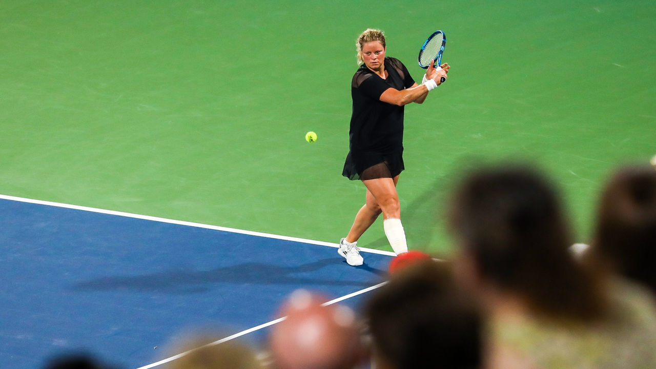 ATLANTA, GA - JULY 25: Kim Clijsters hits a return against Sloane Stephens during the Truist Atlanta Open at Atlantic Station on July 26, 2021 in Atlanta, Georgia.