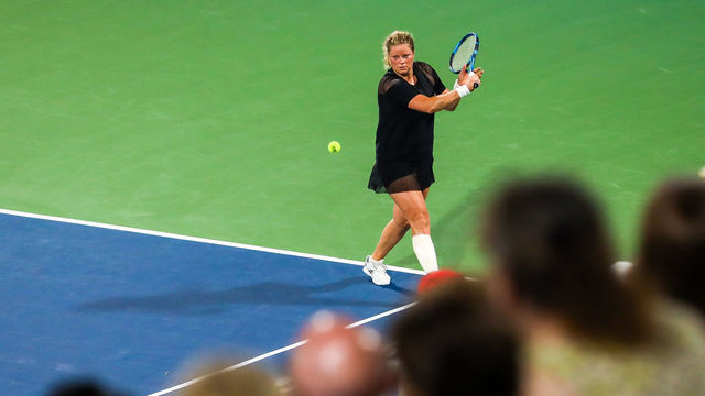 ATLANTA, GA - JULY 25: Kim Clijsters hits a return against Sloane Stephens during the Truist Atlanta Open at Atlantic Station on July 26, 2021 in Atlanta, Georgia.
