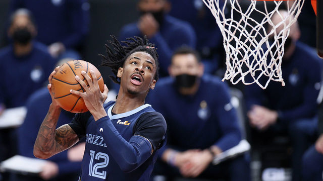 PORTLAND, OREGON - APRIL 25: Ja Morant #12 of the Memphis Grizzlies dunks against the Portland Trail Blazers during the third quarter at Moda Center on April 25, 2021 in Portland, Oregon.