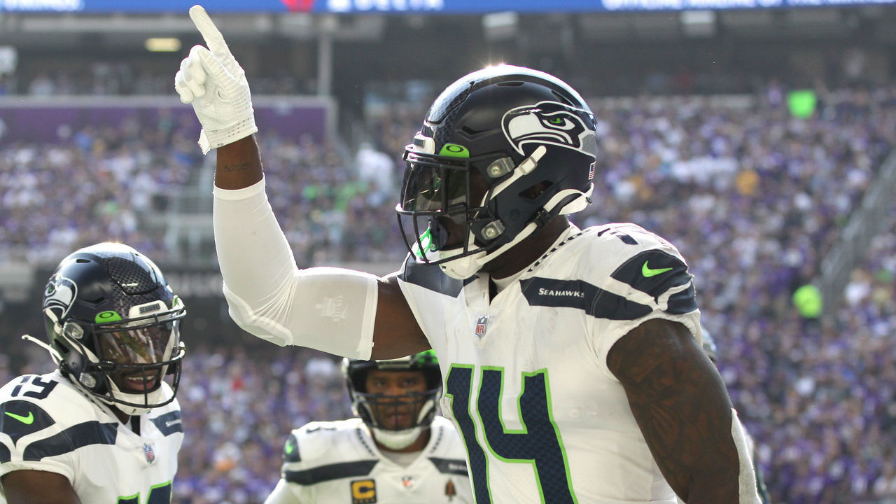 MINNEAPOLIS, MINNESOTA - SEPTEMBER 26: DK Metcalf #14 of the Seattle Seahawks celebrates with Penny Hart #19 and Russell Wilson #3 after catching the ball for a touchdown during the first quarter in the game against the Minnesota Vikings at U.S. Bank Stadium on September 26, 2021 in Minneapolis, Minnesota.