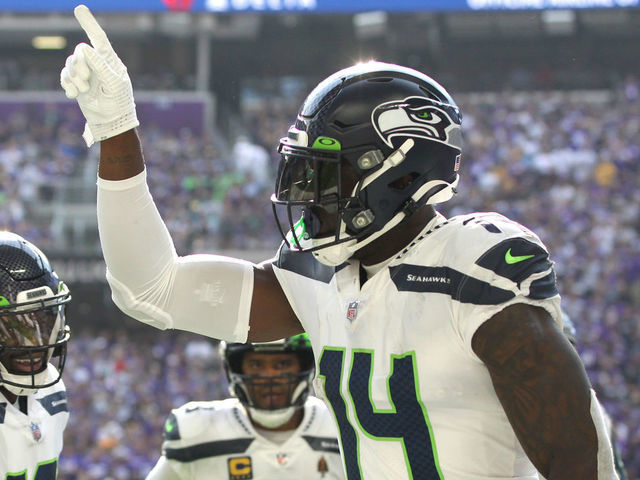 MINNEAPOLIS, MINNESOTA - SEPTEMBER 26: DK Metcalf #14 of the Seattle Seahawks celebrates with Penny Hart #19 and Russell Wilson #3 after catching the ball for a touchdown during the first quarter in the game against the Minnesota Vikings at U.S. Bank Stadium on September 26, 2021 in Minneapolis, Minnesota.