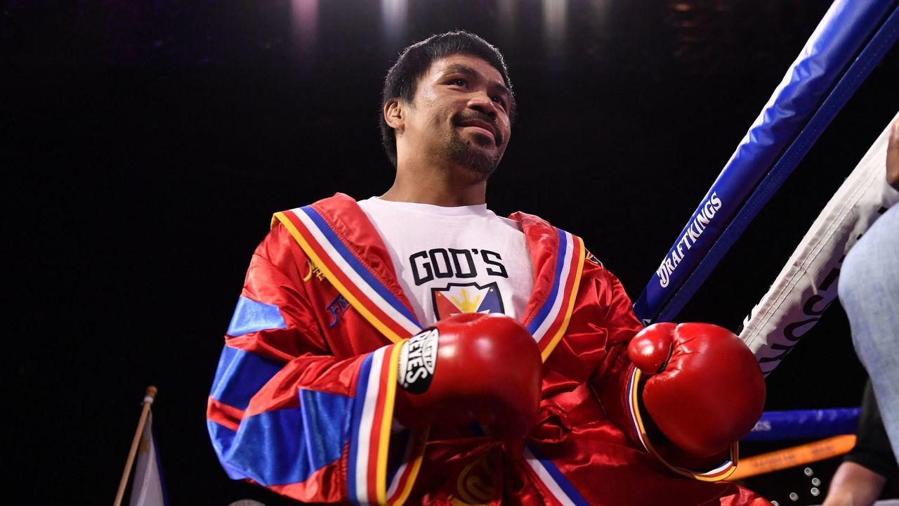 Manny Pacquiao of the Philippines enters the ring for his fight against Yordenis Ugas of Cuba during the WBA Welterweight Championship boxing match at T-Mobile Arena in Las Vegas, Nevada on August 21, 2021. - Cuba's Yordenis Ugas upset Manny Pacquiao to retain his WBA welterweight crown on Saturday, winning by unanimous decision after a bruising 12-round battle at the T-Mobile Arena.