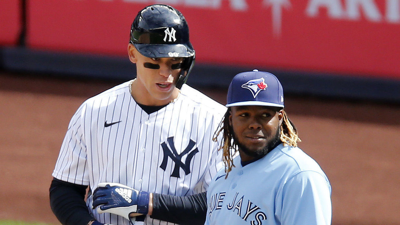 NEW YORK, NEW YORK - APRIL 01: (NEW YORK DAILIES OUT) Aaron Judge #99 of the New York Yankees in action against Vladimir Guerrero Jr. #27 of the Toronto Blue Jays at Yankee Stadium on April 01, 2021 in New York City. The Blue Jays defeated the Yankees 3-2 in ten innings.